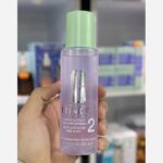 بطری بنفش تونر کلینیک Clarifying Lotion 2 با درپوش سبز مخصوص پوست خشک تا مختلط حجم 200 میلی‌لیتر